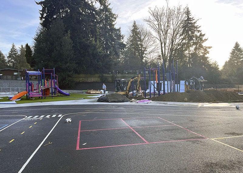 a paved area with striping painted on it